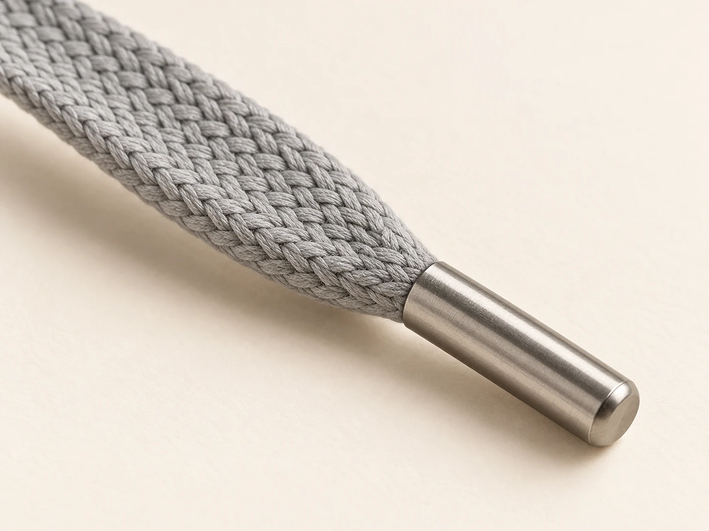 Braided cord construction and metal end tip