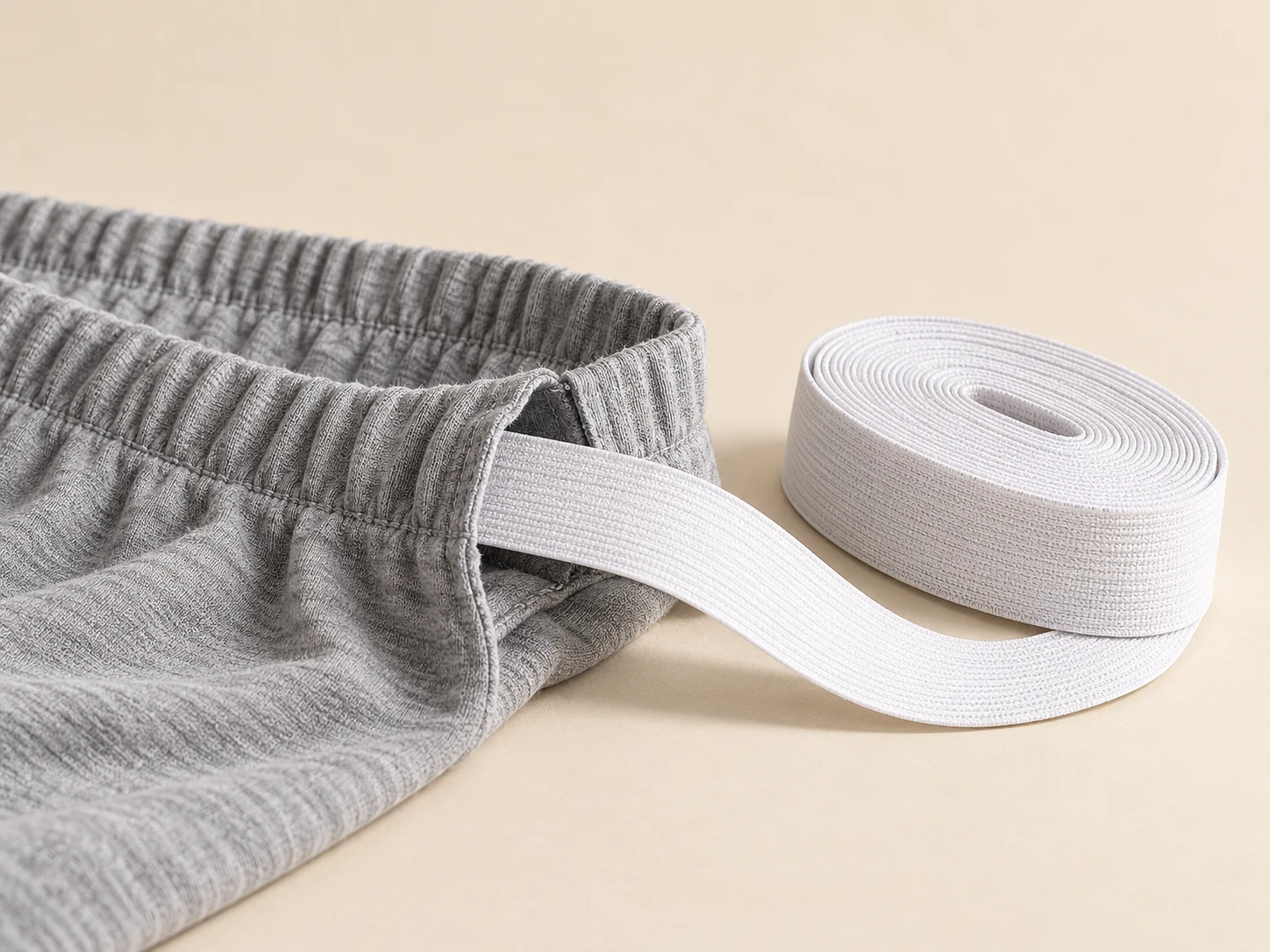 Elastic roll beside a garment waistband